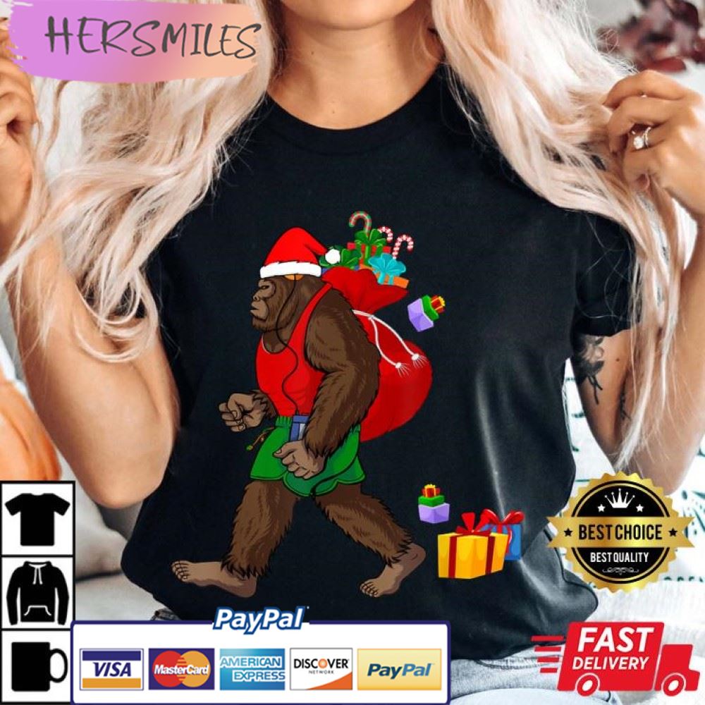 Bigfoot Santa Carrying Christmas Bag Xmas Hat Best T-Shirt Bigfoot Santa Carrying Christmas Bag Xmas Hat Best T-Shirt