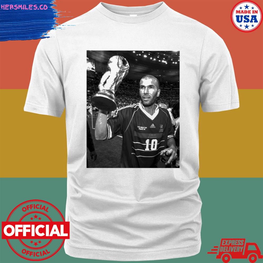 France’s Zinedine Zidane holds the world cup 1998 T-shirt