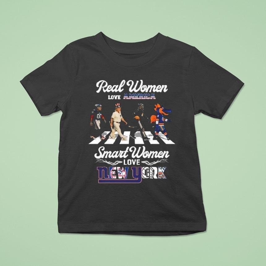 Real Women Love America Smart Women Love New York City Sports Giants Yankees Nets And Islanders Mascot Walking 2025 Shirt